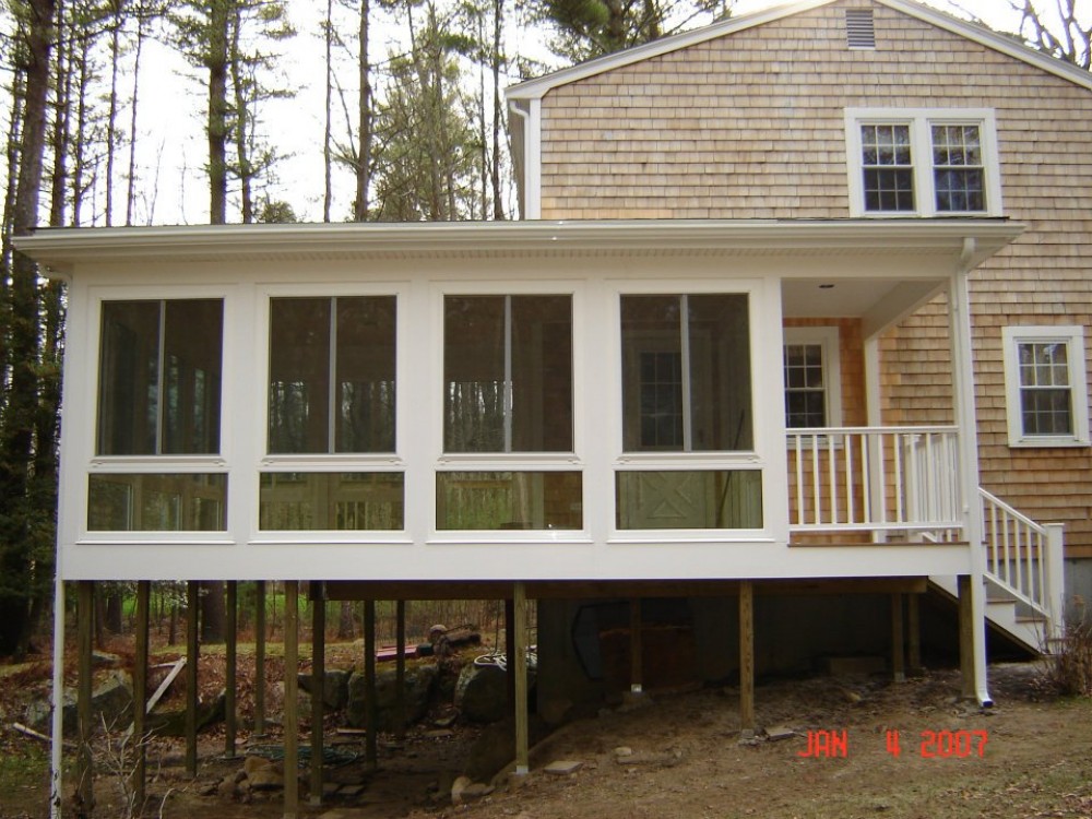 Photo By Care Free Homes Inc.. Sunroom - Before & After