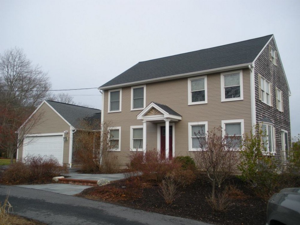 Photo By Care Free Homes Inc.. Vinyl Siding Before & After