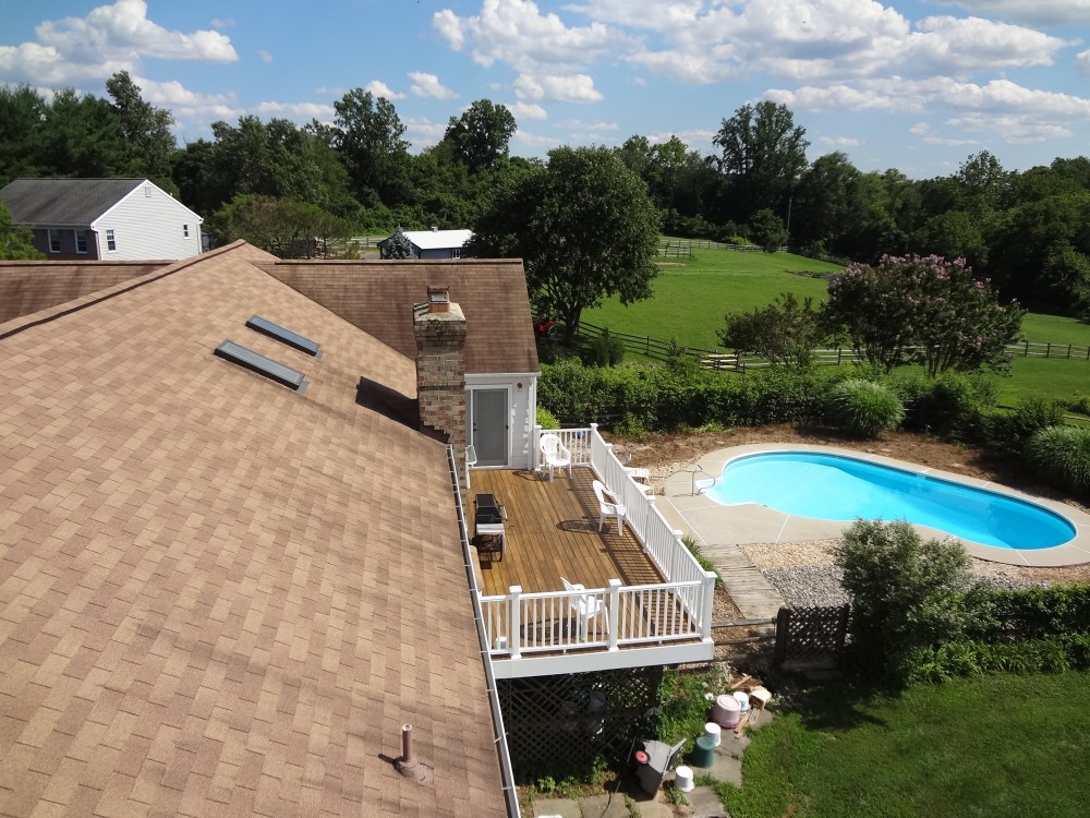 Photo By BRAX Roofing. Chimney Crown.